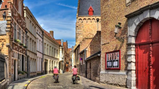 Cycling through the charming old streets of Bruges