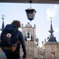 A pilgrim reaches the main square in Leon, Spain, on the Camino
