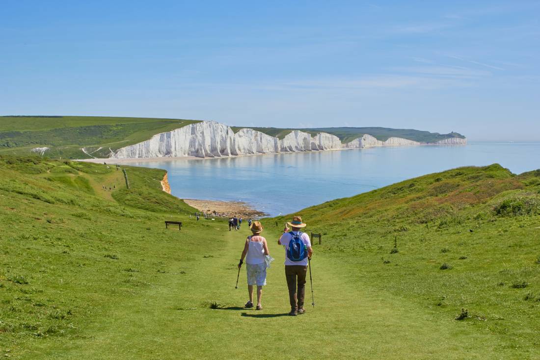 A couple walking towards the Seven Sisters on the South Downs Way |  <i>Marc Najera</i>