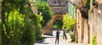 Old street of Domme village in Dordogne department, France