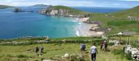 Hikers walking down to Coumeenoole Bay, Dingle