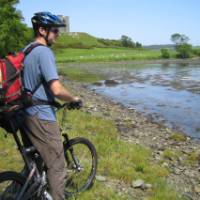 Cyclist by a lake in Northern Ireland