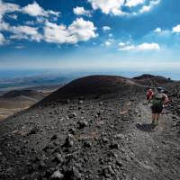 Hiking on Mount Etna volcano in Italy