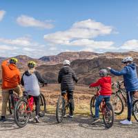 A group of cyclists taking in the spectacular views of Scotland. | Luigi Di Pasquale