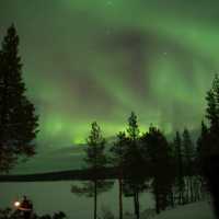 Sky lit up with the northern lights in Swedish Lapland | Ross Baker