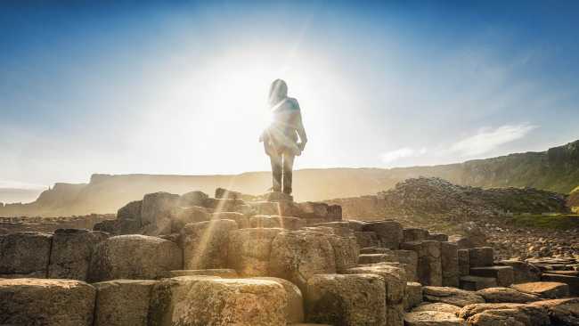 Giants Causeway Hiker in the Sunlight | Caspar Diederik