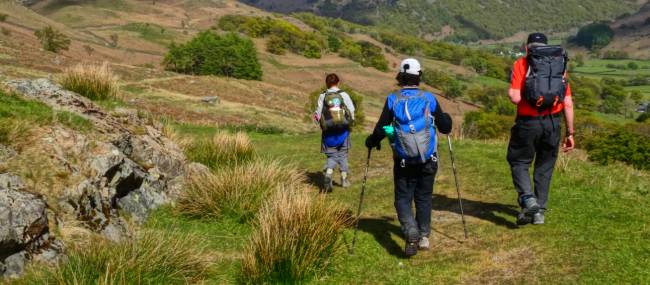 Coast to Coast hikers descending into Borrowdale | John Millen